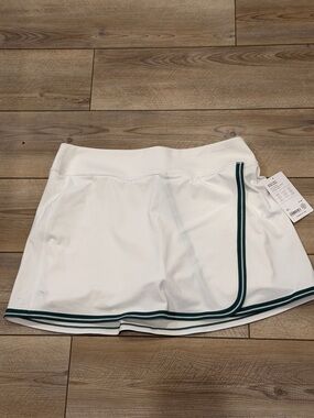 White Women’s Tennis Skort with Green Trim - Athleta